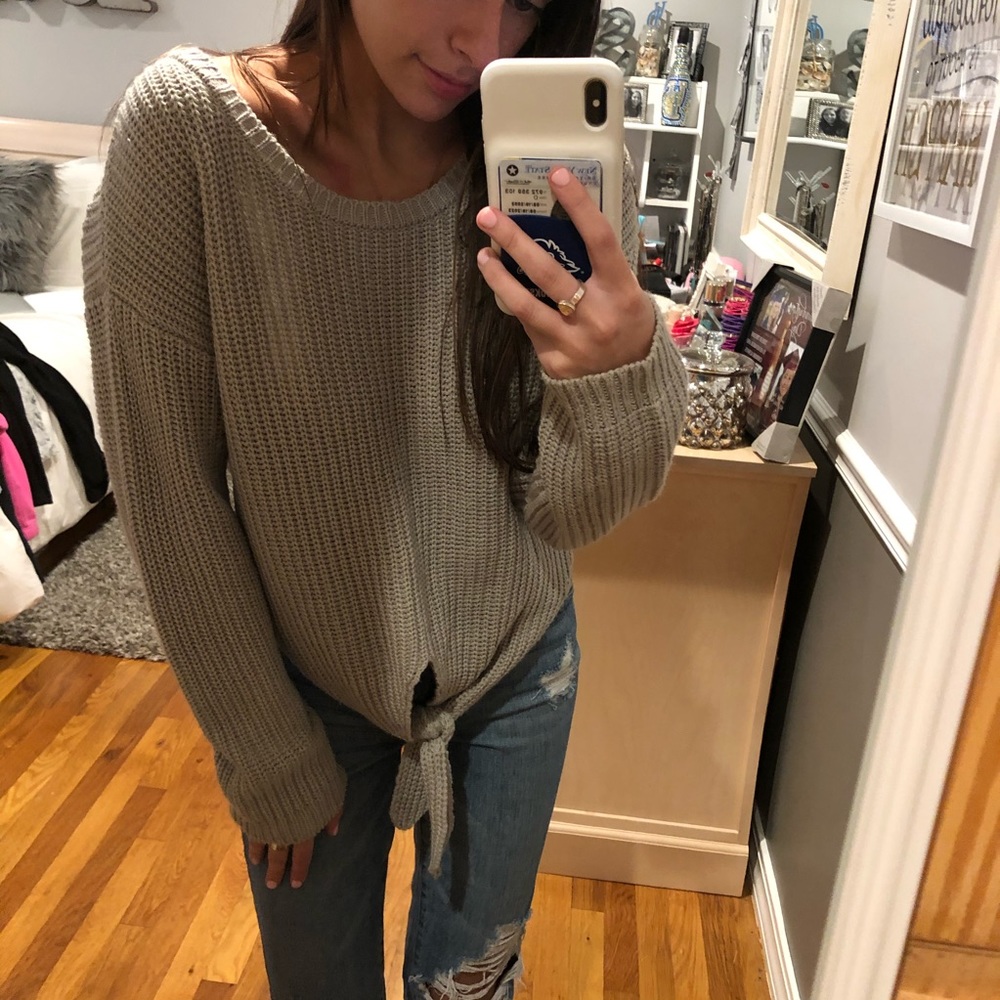 Knotted gray knit sweater